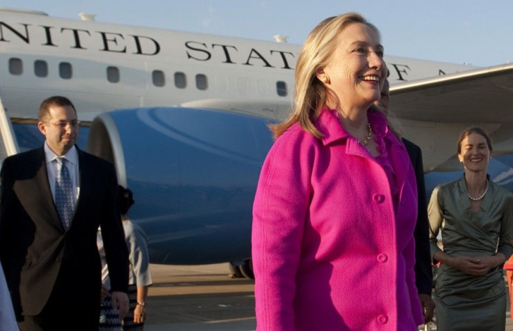 U.S. Secretary of State Clinton smiles upon her arrival in Naypyitaw, Myanmar