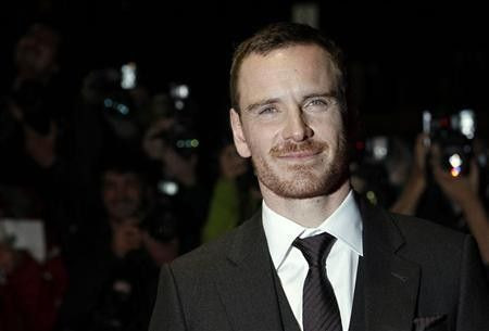 Michael Fassbender poses for photographers as he arrives for the premiere of ''A Dangerous Method'' during the BFI London Film Festival at Leicester Square in London October 24, 2011.
