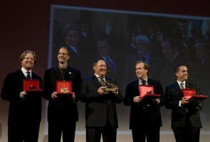 Directors of Walt Disney and Pixar Animation Studios Andrew Stanton (L), Pete Docter (2nd L), Brad Bird and Lee Unkrich (R) pose with John Lasseter (C), chief creative officer at the studios, after receiving the lifetime career awards at the 66th Venice F