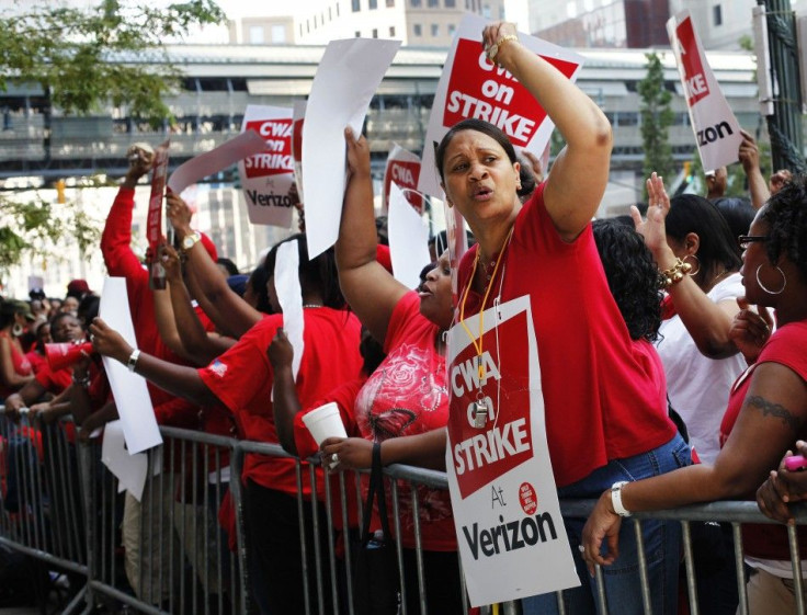 Workers rally outside Verizon headquarters in New York