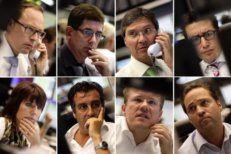 A combination of eight pictures shows share traders reacting in front of their monitors at Frankfurt's stock exchange