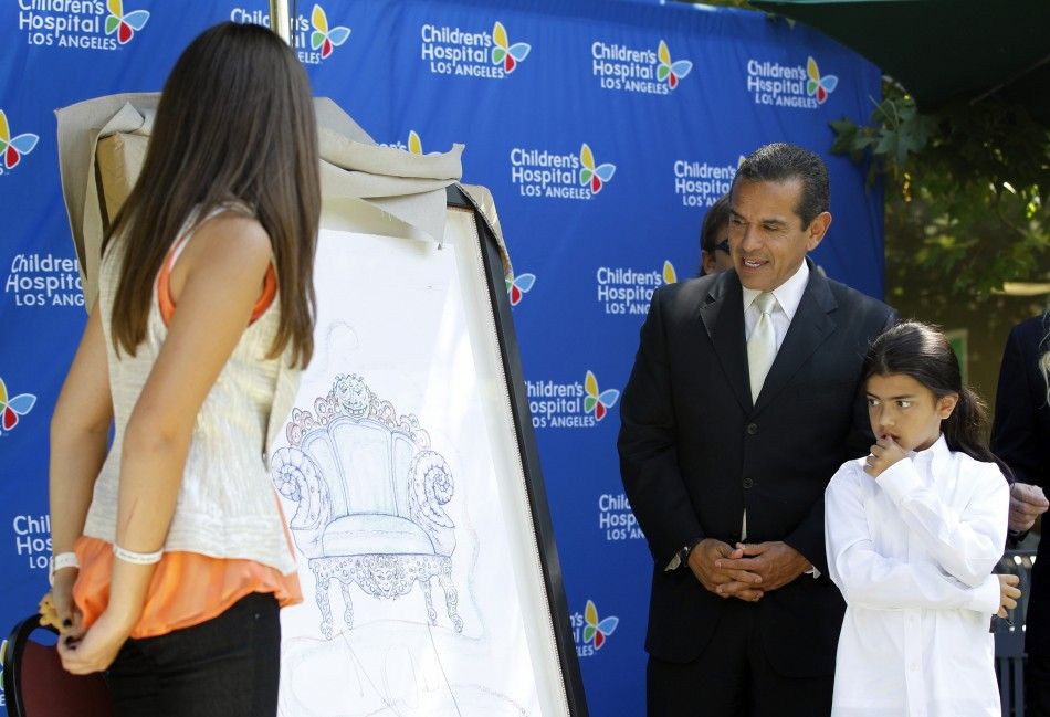 Los Angeles Mayor Antonio Villaraigosa 2nd R, Prince Michael Jackson II Blanket and Paris-Michael Katherine Jackson L unveil a piece of artwork created by late singer Michael Jackson during a private ceremony at Childrens Hospital in Los Angeles 