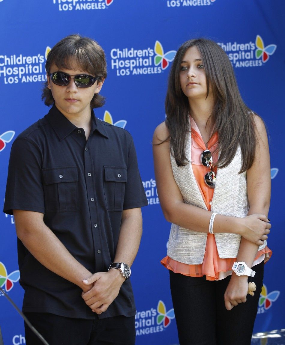 Prince Michael Joseph Jackson Jr. and Paris-Michael Katherine Jackson R attend a private ceremony at the Childrens Hospital in Los Angeles 