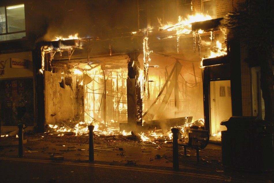 A fierce blaze guts a store after looters rampaged through a shopping mall in Woolwich, southeast London, August 9, 2011