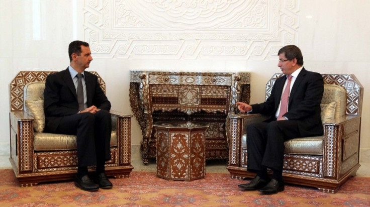 Syria&#039;s President Bashar al-Assad meets with Turkish Foreign Minister Ahmet Davutoglu in Damascus