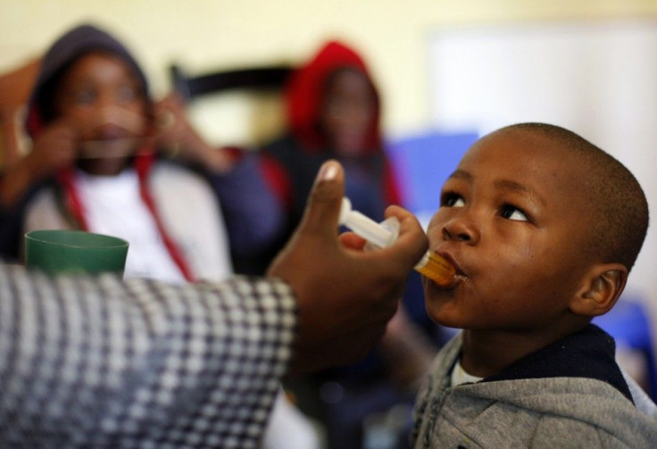 A boy receives medication at Nkosi&#039;s Haven, south of Johannesburg November 25, 2011. Nkosi&#039;s Haven provides residential care for destitute HIV-positive mothers and their children.
