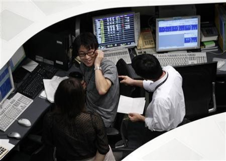 Employees of the Tokyo Stock Exchange (TSE) work at the bourse in Tokyo