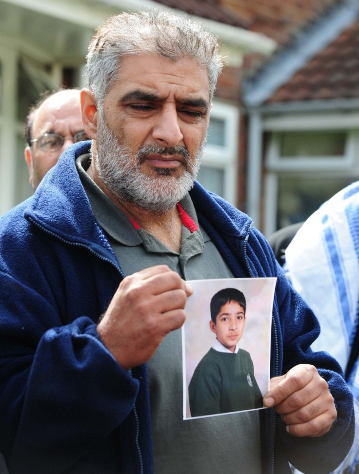 Tarmiq Jahan holds a picture of his son Haroon Jahan after he was killed killed by a car along with two other men in the Winson Green area of Birmingham