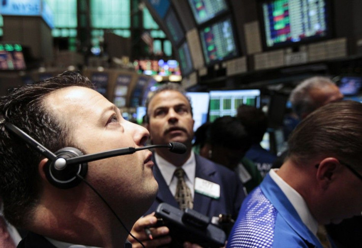 Traders work on the floor of the New York Stock Exchange