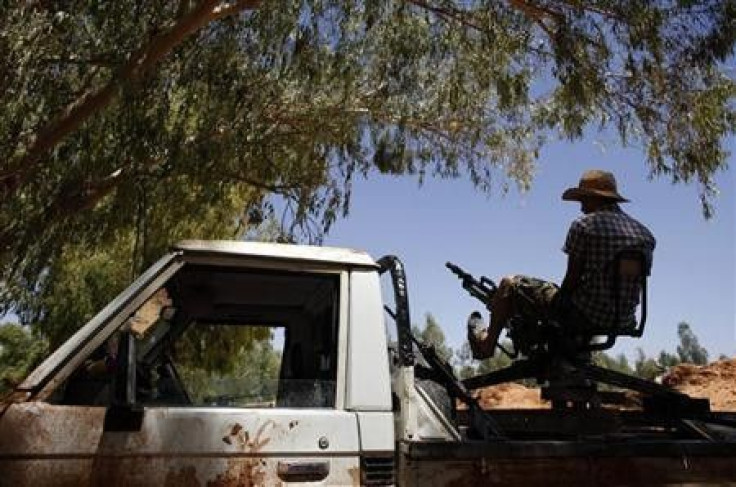 A Libyan rebel fighter mans an anti-aircraft gun