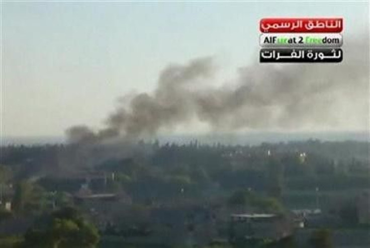 Smoke rises in the city of Deir Al Zour