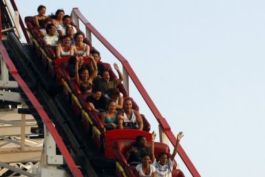 People ride the Cyclone at the Astroland Amusement park in the Coney Island neighborhood of New York