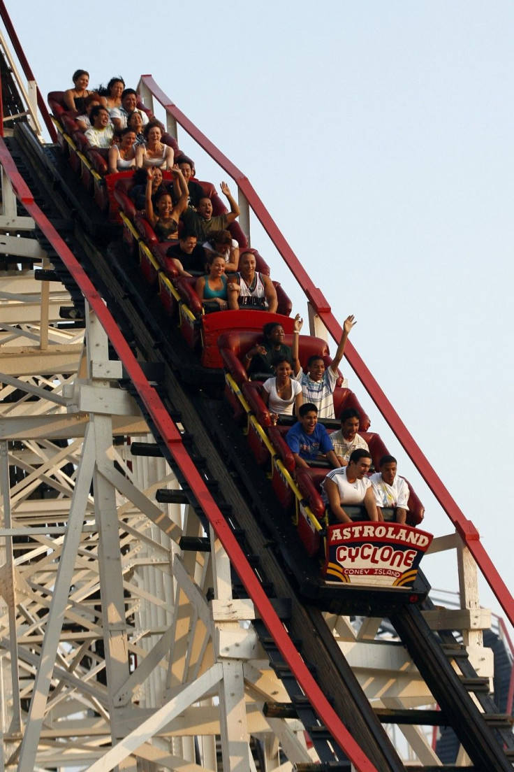 People ride the Cyclone at the Astroland Amusement park in the Coney Island neighborhood of New York