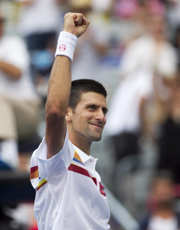 Serbia&#039;s Djokovic celebrates win over Russia&#039;s Davydenko at the Rogers Cup tennis tournament in Montreal