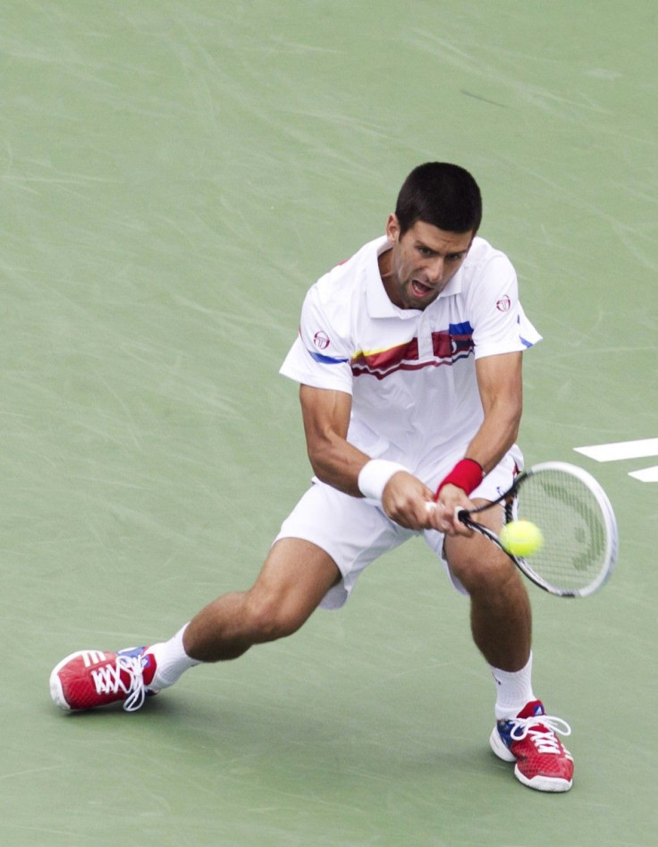 Serbia's Novak Djokovic hits a return to Croatia's Marin Cilic at the Rogers Cup tennis tournament in Montreal