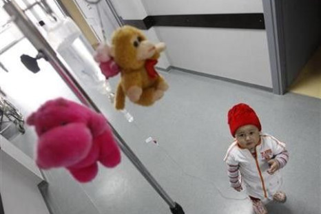 Mari, a 3 year-old leukaemia patient, stands next to her IV drip at the corridor of the onco-hematology department of the Iashvili Central Children&#039;s Hospital in Tbilisi