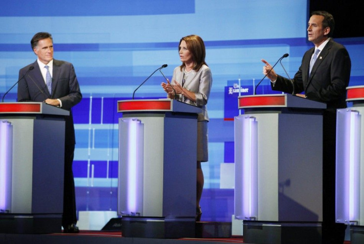 U.S. Republican presidential candidates Mitt Romney, Michele Bachmann and Tim Pawlenty attend the Republican presidential debate in Ames