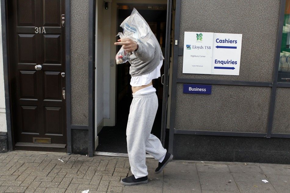 A youth makes a rude gesture as he leaves Highbury Magistrates court where he appeared over his alleged involvement in the trouble in London August 10, 2011