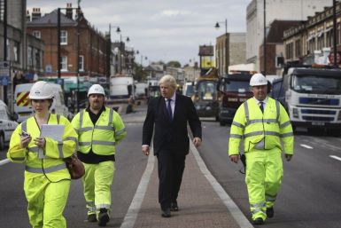 London Mayor Boris Johnson visits an area affected by the riots.