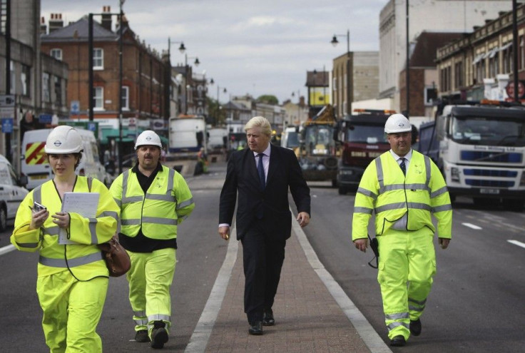 London Mayor Boris Johnson visits an area affected by the riots.