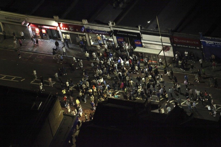 People gather on a street in Eltham southeast