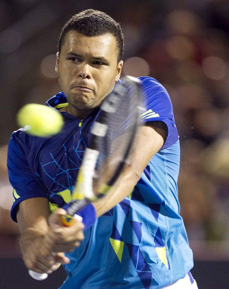 France&#039;s Tsonga hits a return to Switzerland&#039;s Federer at the Rogers Cup tennis tournament in Montreal