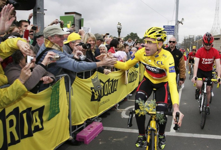 Tour de France winner Evans is congratulated by fans as he rides through the streets of Melbourne during an official homecoming ceremony