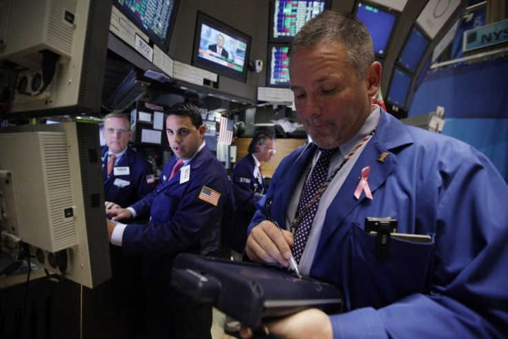 Traders work on the floor of the New York Stock Exchange