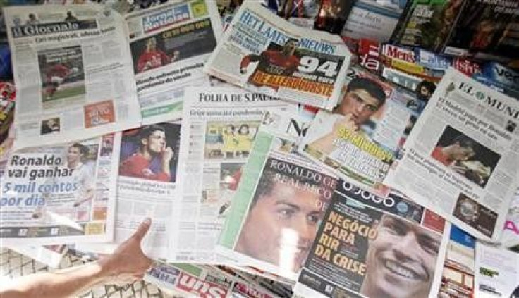 Newspapers featuring Portuguese striker Cristiano Ronaldo on their front pages are displayed in Lisbon