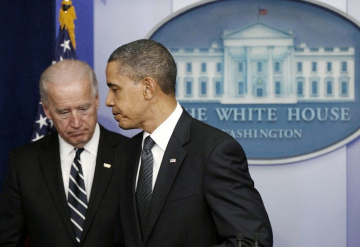 President Obama walks off the podium in front of Vice President Biden