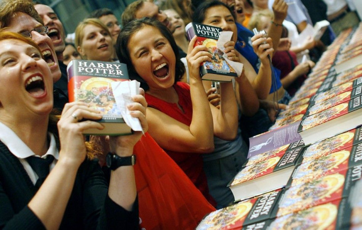 Fans of the Harry Potter book series pose for media at the start of the sales of J.K. Rowling&#039;s &quot;Harry Potter and the Deathly Hallows&quot; in Berlin