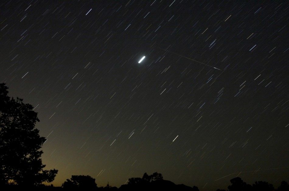 A meteor streaks past stars in the night sky in Tecate in Baja California