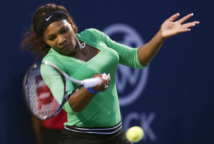 Williams returns a shot to Safarova at the Rogers Cup women&#039;s tennis tournament in Toronto
