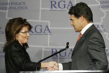 Governor Sarah Palin shakes hands with Gov. Rick Perry during a Plenary Session at the 2008 Republican Governors Association Annual Conference