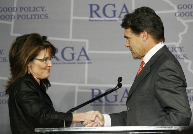 Governor Sarah Palin shakes hands with Gov. Rick Perry during a Plenary Session at the 2008 Republican Governors Association Annual Conference