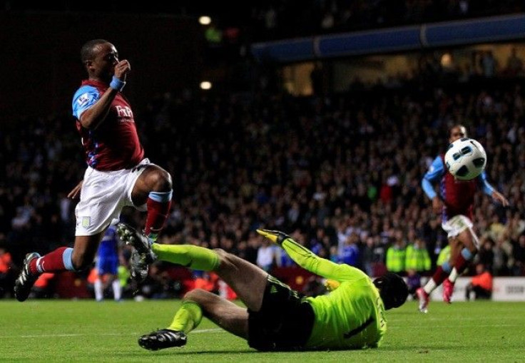Aston Villa-s Reo-Coker fails to score past Chelsea-s Cech during their English Premier League soccer match in Birmingham.