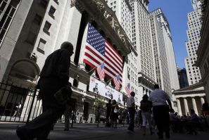 People walk past the New York Stock Exchange in New York