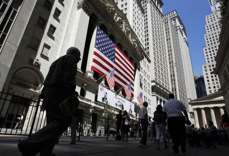 People walk past the New York Stock Exchange in New York