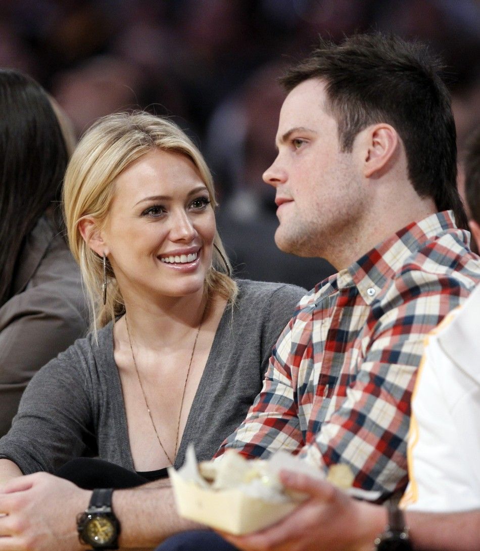 Actress Duff and her fiance, pro hockey player Comrie, sit court side during the NBA Western Conference final playoff series between the Los Angeles Lakers and the Phoenix Suns in Los Angeles