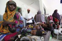 Geediyo Mohamed Abdi, a displaced Somali mother, sits next her children in Banadir hospital in Mogadishu
