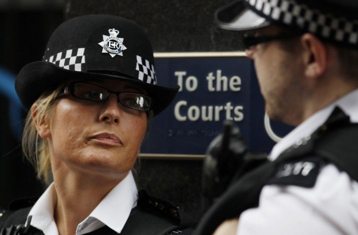 Two police officers stand outside Westminster Magistrates Court in London
