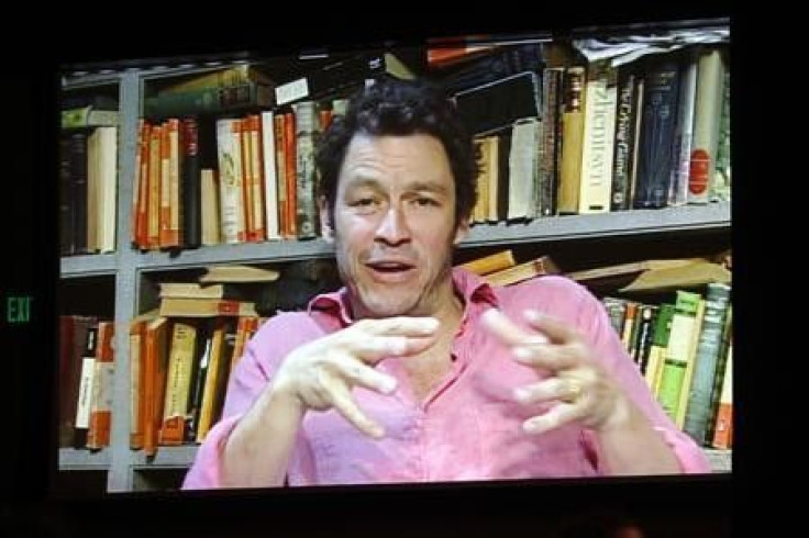 Actor Dominic West, shown on a video screen via satellite from London, takes part in a panel discussion about the BBC America series &quot;The Hour&quot;, in which he is acting, during the 2011 Summer Television Critics Association Cable Press Tour in Bev