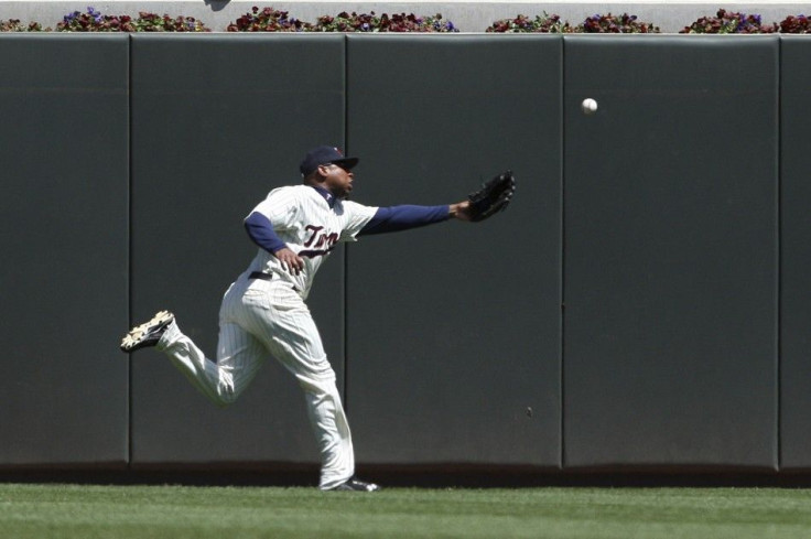 Minnesota Twins' Young fails to catch a two-RBI double by Toronto Blue Jays' Hill in Minneapolis
