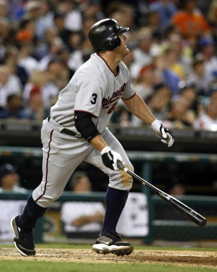 Twins&#039; Thome watches his home-run hit against the Tigers, giving him 600 career home-runs, during their MLB American League baseball game in Detroit