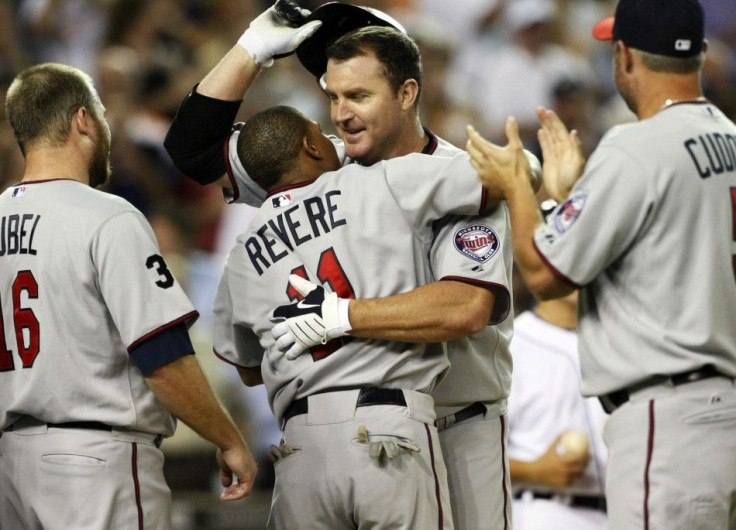 Minnesota Twins&#039; Thome celebrates at home-plate with his teammates after hitting his 600th career home-run during their MLB American League baseball game against the Detroit Tigers in Detroit