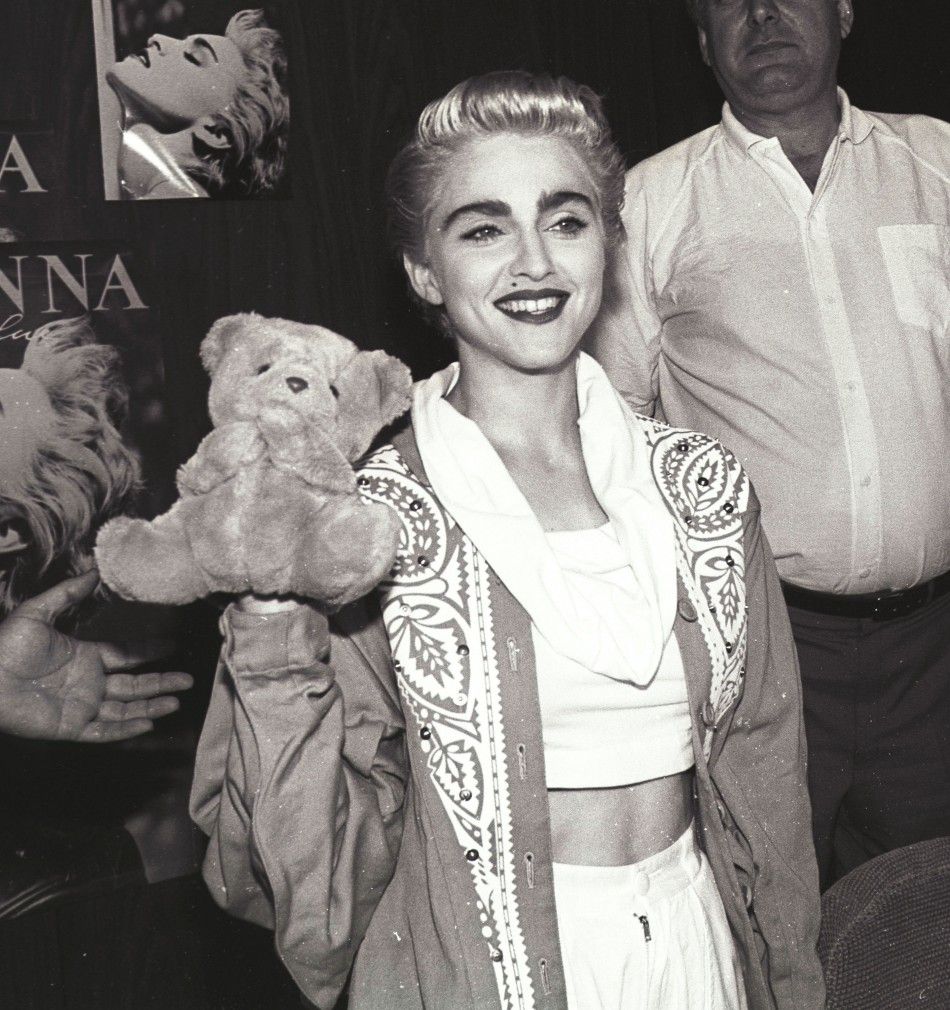 Madonna displays BJ the puppet following a presentation of an award from WEA Recordsin Toronto