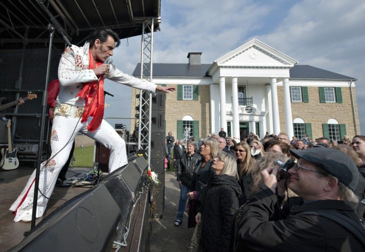 An Elvis Presley impersonator performs in front of Graceland Randers before its opening in Randers, Denmark