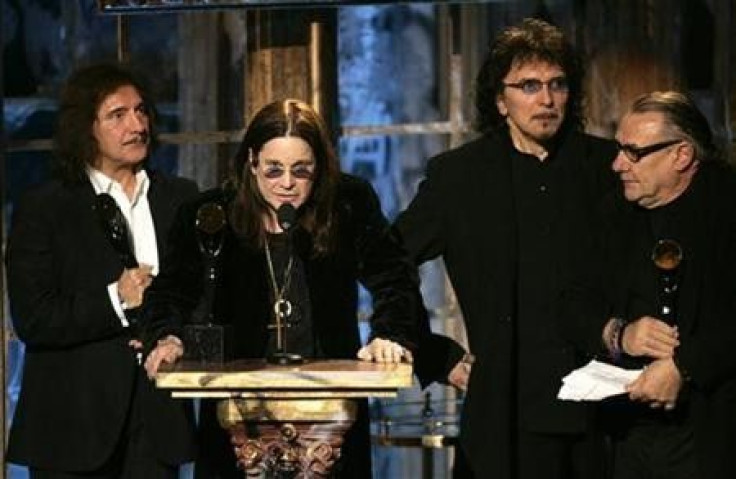 Members of the band Black Sabbath Tommy Iommi, Ozzy Osbourne, Geezer Butler and Bill Ward (L-R) react after being inducted into the Rock and Roll Hall of Fame at the 2006 Rock and Roll Hall of Fame induction ceremony at the Waldorf Astoria Hotel in New Yo