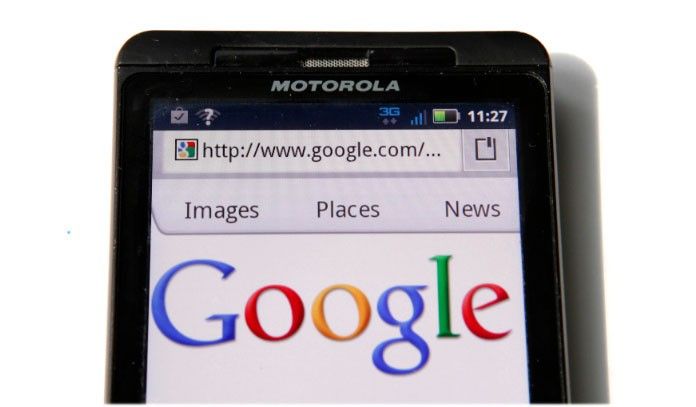 A Google homepage is displayed on a Motorola Droid phone in Washington August 15, 2011