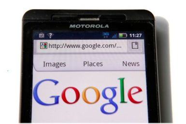 A Google homepage is displayed on a Motorola Droid phone in Washington August 15, 2011